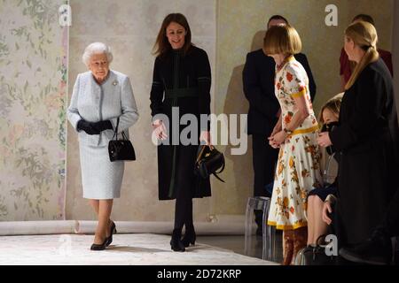 Queen Elizabeth II presents the Queen Elizabeth II Award for British Design to designer Richard Quinn, after his London Fashion Week show, held at the BFC showspace, London. Picture date: Tuesday February 20th 2018. Photo credit should read: Matt Crossick/ EMPICS Entertainment. Stock Photo