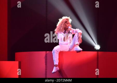 EDITORIAL USE ONLY.  Rita Ora performs on stage at the Brit Awards at the O2 Arena, London. Stock Photo