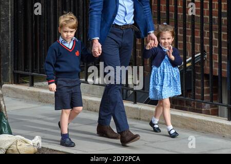 The Duke of Cambridge with Prince George and Princess Charlotte arriving at the Lindo Wing at St Mary's Hospital in Paddington, London. Photo credit should read: Matt Crossick/EMPICS Entertainment Stock Photo