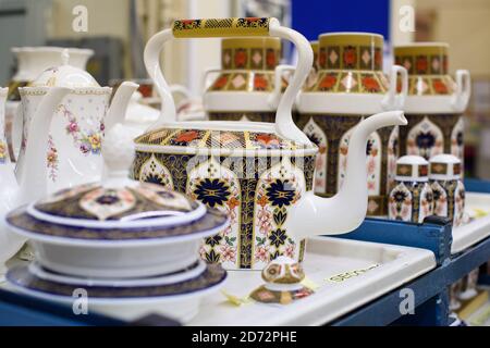 Pieces of china tableware after lithographers apply designs to them, at Royal Crown Derby's workshop in Derby, England. The company, which dates back to 1750, has just announced its commemorative pieces in honour of the royal wedding between Prince Harry and Meghan Markle. Royal Crown Derby's bone china is still made entirely in the UK, using techniques largely unchanged since the 18th century. Picture date: Thursday April 19th, 2018. Photo credit should read: Matt Crossick/ EMPICS Entertainment. Stock Photo