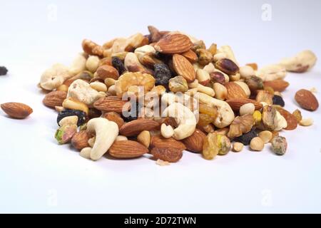 Close up of mixed nuts on white background  Stock Photo