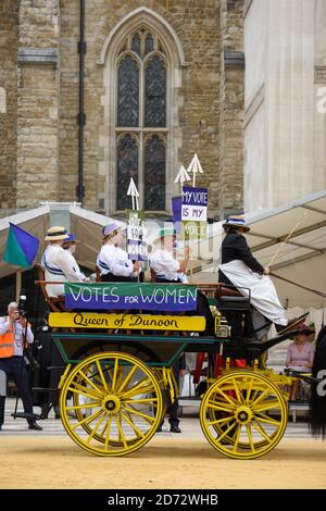 Members of the Worshipful Company of Carmen drive their historic carts and vehicles to Guildhall, in the City of London, for the annual Cart Marking Ceremony. The tradition, originating in the licensing of vehicles for hire in the 17th century, sees each vehicle branded with a letter to mark its official licensed status. Picture date: Wednesday July 18th, 2018. Photo credit should read: Matt Crossick/ EMPICS Entertainment. Stock Photo