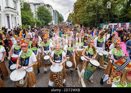 Dancers and drummers on the parade route during the second day of the Notting Hill Carnival in London. Picture date: Monday August 27th, 2018. Photo credit should read: Matt Crossick/ EMPICS Entertainment. Stock Photo