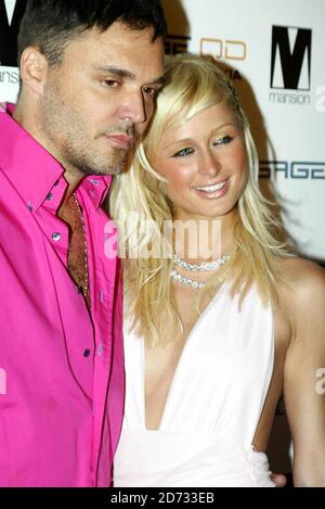 Paris Hilton with David Lachappelle at her 'Screwed' album launch party held at Mansion Miami beach 8/28/04  [[sah]] Stock Photo