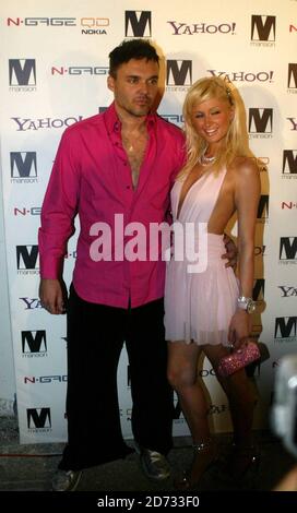 Paris Hilton with David Lachappelle at her 'Screwed' album launch party held at Mansion Miami beach 8/28/04  [[sah]] Stock Photo