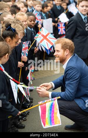 The Duke of Sussex meets schoolchildren at a Queen's commonwealth canopy and woodland tree planting, at St Vincentâ€™s Catholic Primary School in west London. Picture date: Wednesday March 20, 2019. Photo credit should read: Matt Crossick/Empics Stock Photo