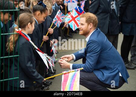 The Duke of Sussex meets schoolchildren at a Queen's commonwealth canopy and woodland tree planting, at St Vincentâ€™s Catholic Primary School in west London. Picture date: Wednesday March 20, 2019. Photo credit should read: Matt Crossick/Empics Stock Photo