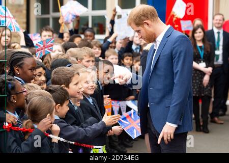 The Duke of Sussex meets schoolchildren after a Queen's commonwealth canopy and woodland tree planting, at St Vincentâ€™s Catholic Primary School in west London. Picture date: Wednesday March 20, 2019. Photo credit should read: Matt Crossick/Empics Stock Photo