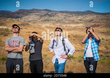 Eye protection during Total solar eclipse 2017, in the Painted Hills, in eastern Oregon,USA,   John Day Fossil Beds National Monument Stock Photo