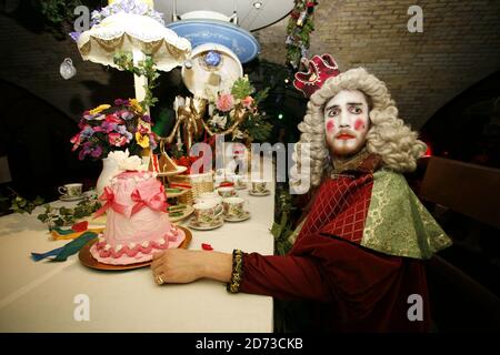 The Alice in Wonderland themed tea party at the Corsa Presents Bandstand, a new live music indoor festival in Old Billingsgate, London. Stock Photo