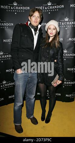 Kris Marshall and Kelly Eastwood arrive at the launch of the Atelier Moet pop-up boutique in Bond Street, central London. Stock Photo