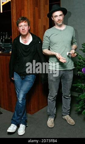 Andy Dunlop (left) and Fran Healey of Travis pose for photographs after ...