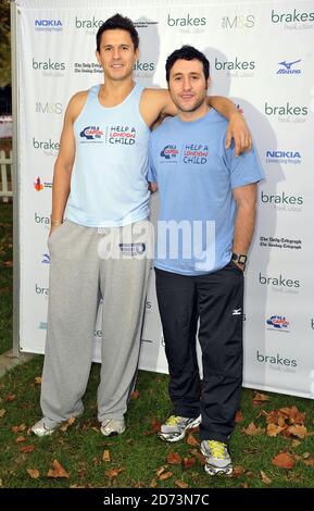 Jeremy Edwards and Antony Costa seen at the start of the Royal Parks Foundation Half Marathon, in Hyde Park in central London Stock Photo