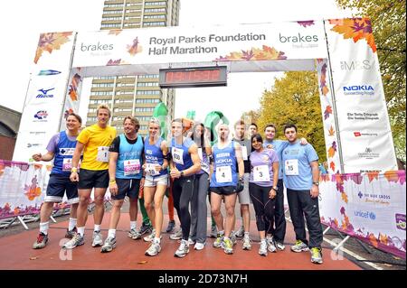 (l-r) Gary Webster, Ben Fogle, Charley Boorman, Nell McAndrew, Matt Roberts, Rachel Christie, Jacskon Williams, Tom Aikens, Jeremy Edwards, Rani Price, Greg Burns and Antony Costa on the start line of the Royal Parks FOundation Half Marathon, in Hyde Park in central London Stock Photo