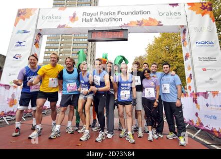 (l-r) Gary Webster, Ben Fogle, Charley Boorman, Nell McAndrew, Matt Roberts, Rachel Christie, Jacskon Williams, Tom Aikens, Jeremy Edwards, Rani Price, Greg Burns and Antony Costa on the start line of the Royal Parks FOundation Half Marathon, in Hyde Park in central London Stock Photo