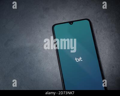 Lod, Israel - July 8, 2020: Bit app launch screen with logo on the display of a black mobile smartphone on dark marble stone background. Top view flat Stock Photo