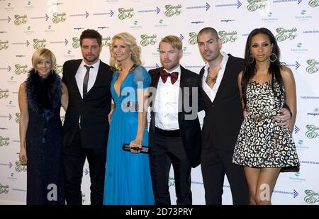 (l-r) Lisa Duffy, Keith Duffy, Yvonne Keating, Ronan Keating, Shane Lynch and wife Sheena Lynch arrive at the Emeralds and Ivy Ball in aid of Cancer Research UK held at Battersea Evolution in south London Stock Photo