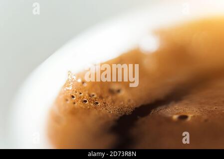 Cup of black coffee macro shot of foam Stock Photo