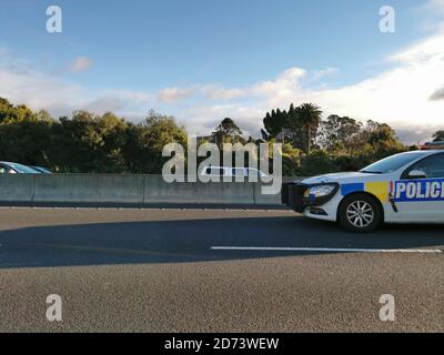 AUCKLAND, NEW ZEALAND - Jul 04, 2019: Auckland / New Zealand - July 4 2019: View of Police Holden Commodore car at motorway