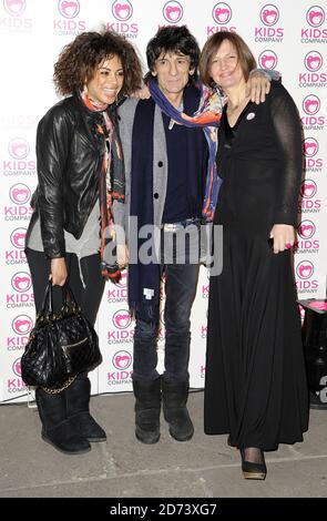 Ronnie Wood, girlfriend Ana Araujo (l) and friend arrive at the Shoebox Art Auction, in aid of the Kids Company, at the Haunch of Venison in central London. Stock Photo