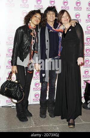 Ronnie Wood, girlfriend Ana Araujo (l) and friend arrive at the Shoebox Art Auction, in aid of the Kids Company, at the Haunch of Venison in central London. Stock Photo