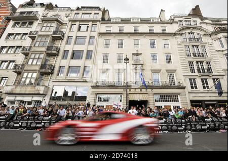 Cars cross the start line of the Gumball 3000 Rally, which saw over 100 supercars lined up on Pall Mall in central London for the race start.   Stock Photo