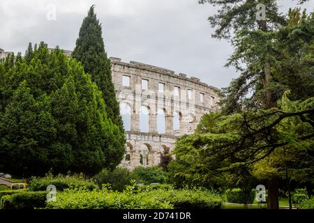 View from the exterior of the remains of the iconic ancient Roman amphitheatre at Pula, Istria, Croatia, a leading local tourist attraction Stock Photo