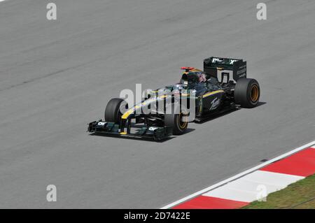 SEPANG, MALAYSIA - APRIL 2 : Lotus Racing driver Fairuz Fauzy of Malaysia drives during the first practice session at the Sepang F1 circuit April 2, 2 Stock Photo