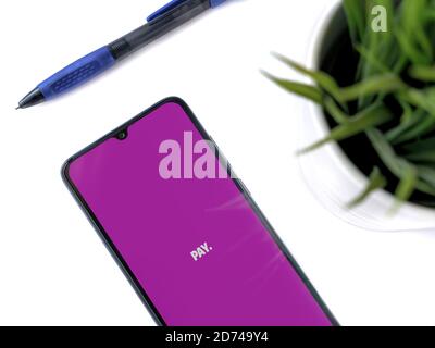 Lod, Israel - July 8, 2020: PAY app launch screen with logo on a white background. Close up top view flat lay. Stock Photo