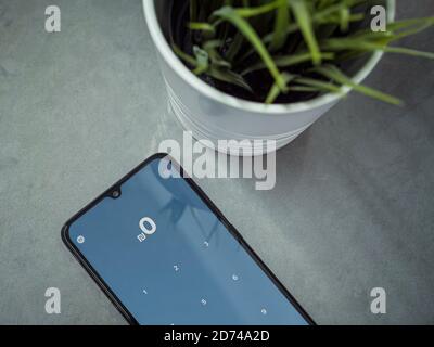 Lod, Israel - July 8, 2020: PAY app launch screen with logo on a marble background. Close up top view flat lay. Stock Photo
