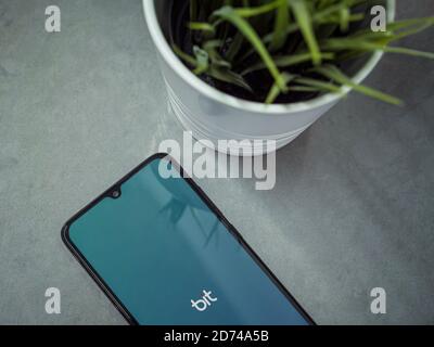Lod, Israel - July 8, 2020: Bit app launch screen with logo on a marble background. Close up top view flat lay. Stock Photo