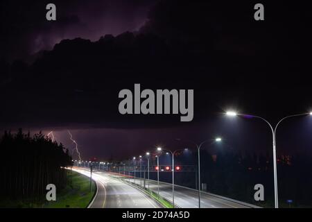 night clouds with lightning over the night route Stock Photo