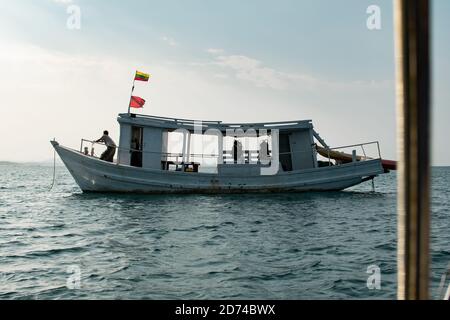 Ngwesaung, Myanmar - December 29, 2019: A boat for recreational scuba diving against the horizon outside the beach on December 29, 2019 in Ngwesaung, Stock Photo