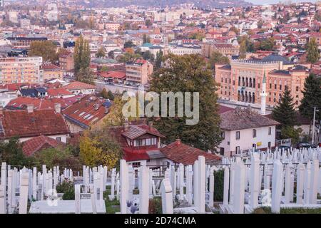 Bosnia and Herzegovina, Sarajevo, View of Alifakovac graveyard (where Muslim foreigners are buried) and City looking towards City Hall Stock Photo