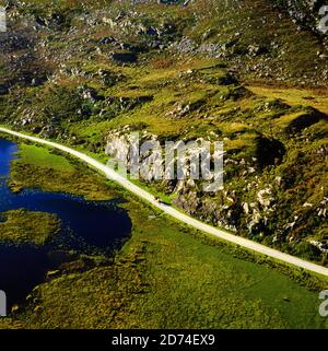 Vintage Aerial Photography Circa 1970, of a pony and trap in the The Gap of Dunloe, a narrow mountain pass that separates the MacGillycuddy's Reeks mountain range in the west, from the Purple Mountain Group range in the east, Killarney National Park, County Kerry, Ireland. Stock Photo