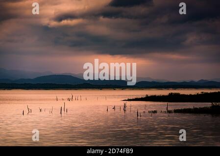 Mystical light in the early morning at dam thailand. Landscape Stock Photo