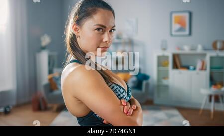 Busty athletic model smiling happily at camera Stock Photo