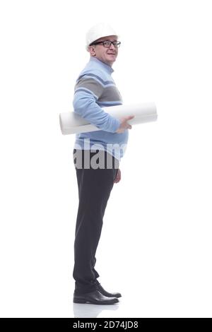 side view. a man with a roll of drawings looking somewhere ahead. Stock Photo