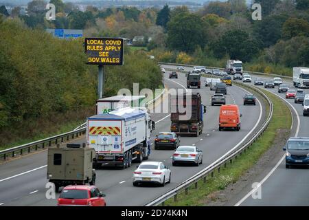 Cardiff, Wales, UK. 19/10/2020. Traffic travelling east into Cardiff and beyond are reminded of restrictions in place because of Covid 19. First Minis Stock Photo