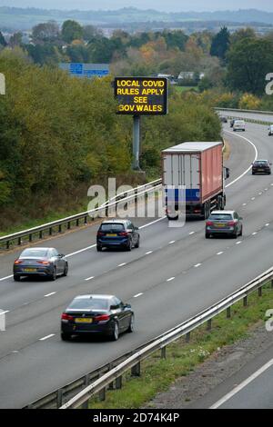 Cardiff, Wales, UK. 19/10/2020. Traffic travelling east into Cardiff and beyond are reminded of restrictions in place because of Covid 19. First Minis Stock Photo