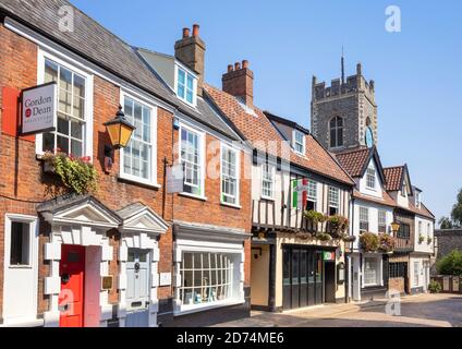 Church Tower of Parish Church of St George shops and  Italian restaurant on Princes street Tombland Norwich Norfolk East Anglia England UK GB Europe Stock Photo