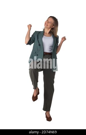 Young business woman winner holding fists isolated on white background full length studio portrait Stock Photo