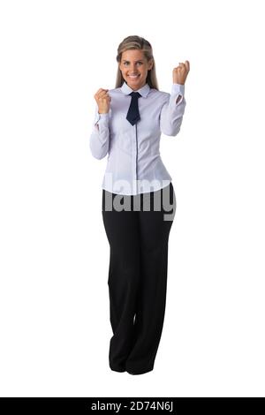 Young business woman winner holding fists isolated on white background full length studio portrait Stock Photo