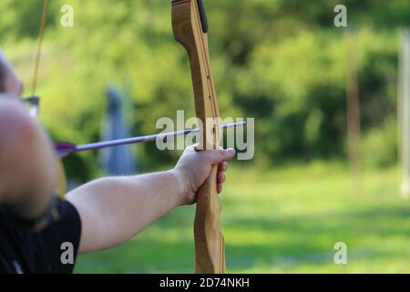Closeup shot of a man practicing archery - concept of Archery Stock Photo