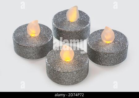 Four silver LED candles set Stock Photo