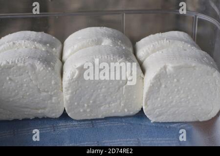 Close up picture of some typical swiss fresh formaggino made of cow and goats milk Stock Photo