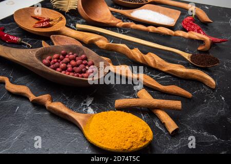 hand carved wooden kitchen tools on the table Stock Photo