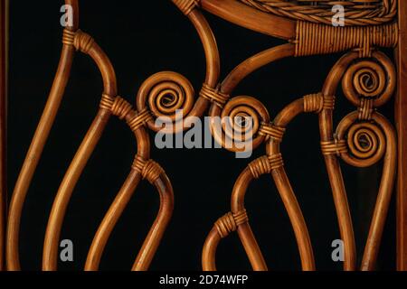 Texture weaving patterns vine on a black background. Wicker Straw. Stock Photo