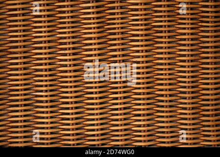 Texture weaving patterns vine on a black background. Wicker Straw Basket. Stock Photo
