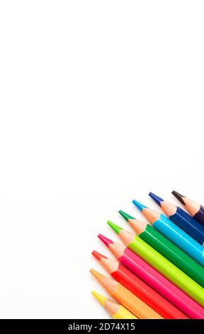 Colored pencils in a circle, white background, top view Stock Photo